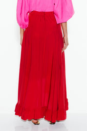 A model wearing the All Night Long Skirt in colour Lipstick (Red), from the back