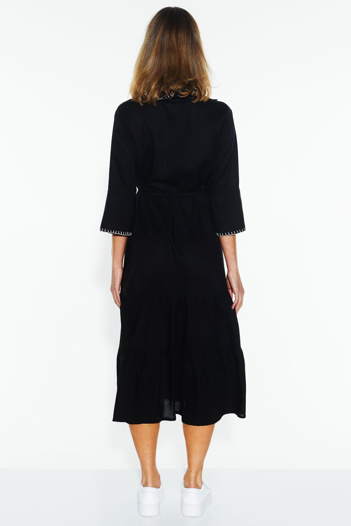 A model wearing the Showcase Tencel Blend Dress in colour Black (Black), from the back