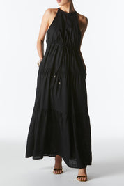 A model wearing the Midsummer Halter Linen Blend Maxi Dress in colour Black (Black), from the front, cropped image