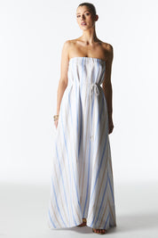 A model wearing the Poolside Boxy Linen Dress in colour Stripe (Blue), from the front, showing the whole outfit