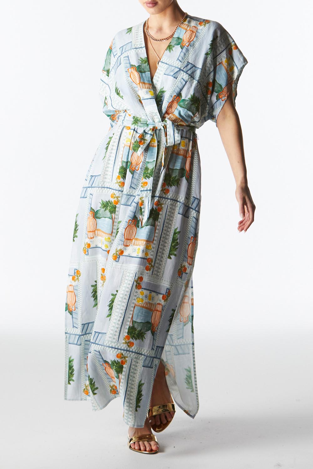 A model wearing The Terrace Linen Cotton Dress in colour Postcard (Blue), from the front, cropped image