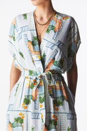 A model wearing The Terrace Linen Cotton Dress in colour Postcard (Blue), from the front, cropped image