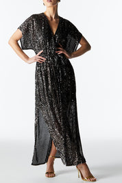 A model wearing the Impression Sequin Dress in colour Gunmetal (Black), from the front, cropped image