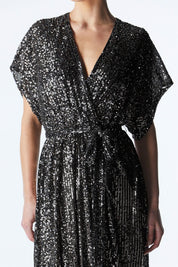 A model wearing the Impression Sequin Dress in colour Gunmetal (Black), from the front, cropped image