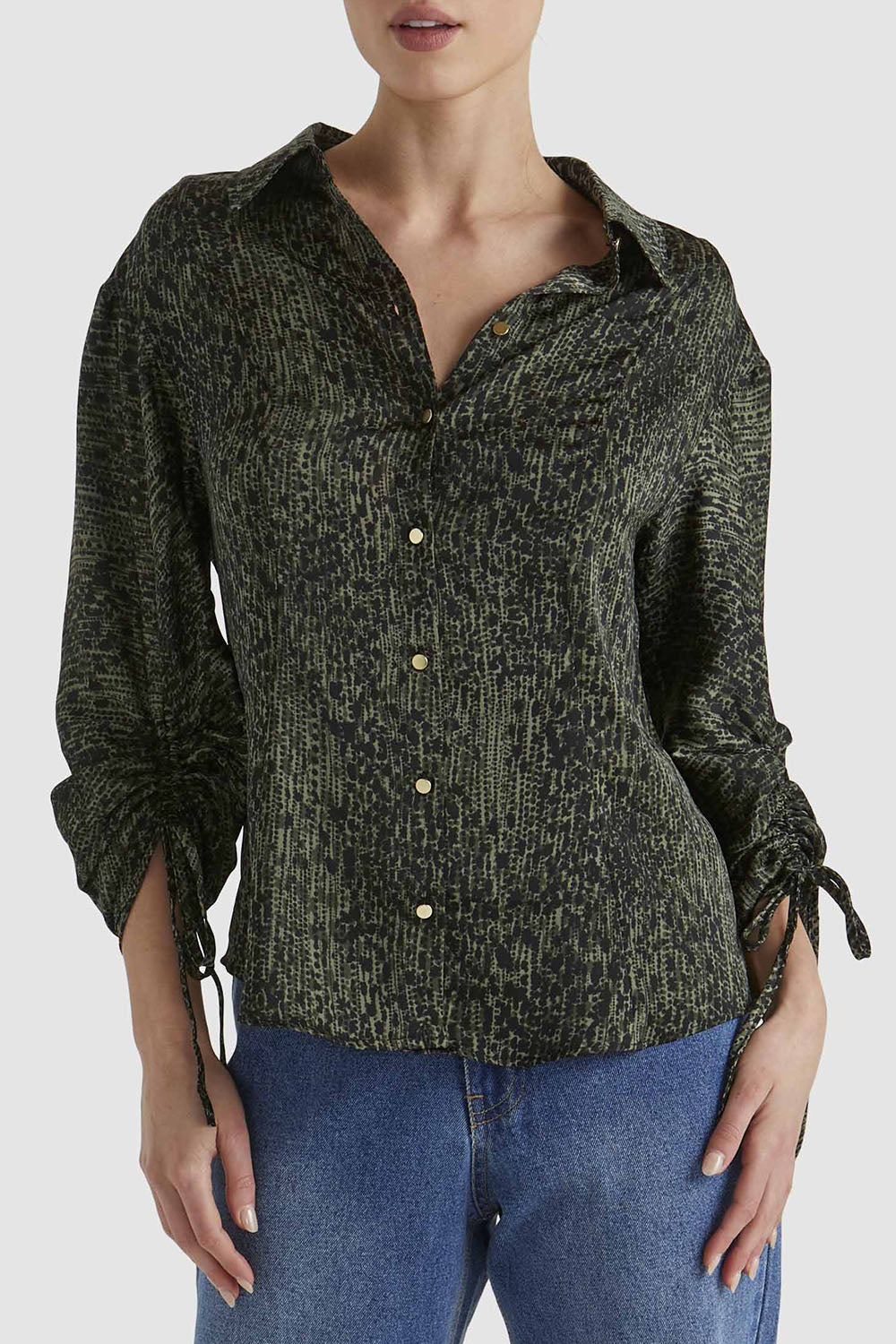 A model wearing the Explorer Shirt in colour Leopard (Green), from the front, cropped image