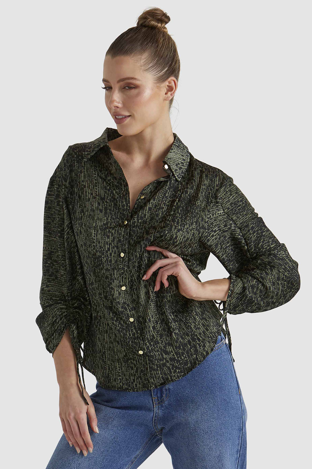 A model wearing the Explorer Shirt in colour Leopard (Green), from the front, cropped image