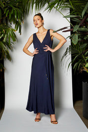 A model wearing the Fusion Dress in colour Navy (Blue), from the front, showing the whole outfit