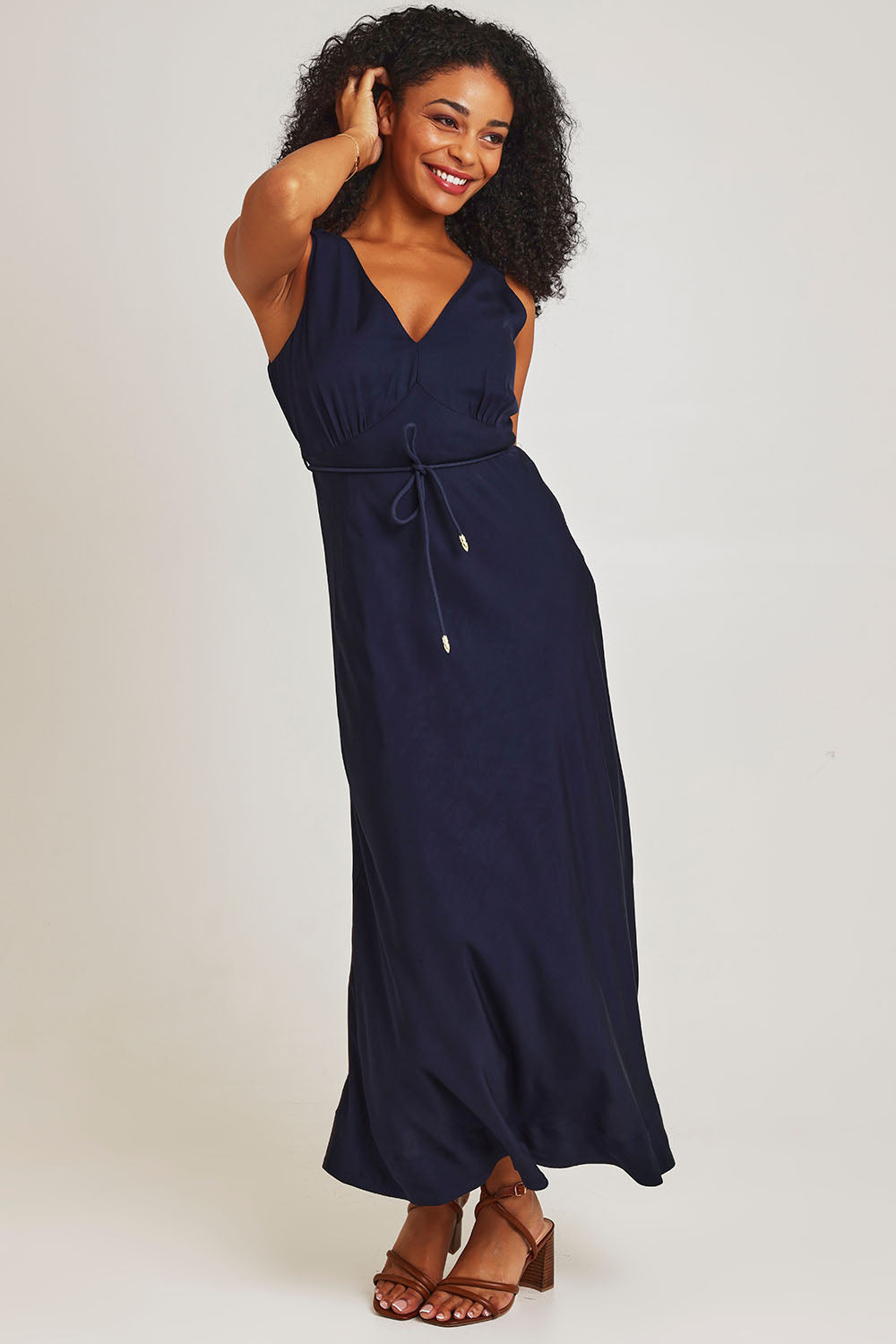 Model Ziara wearing size 10 of the Fusion Dress in colour Navy (Blue), from the front, showing the whole outfit