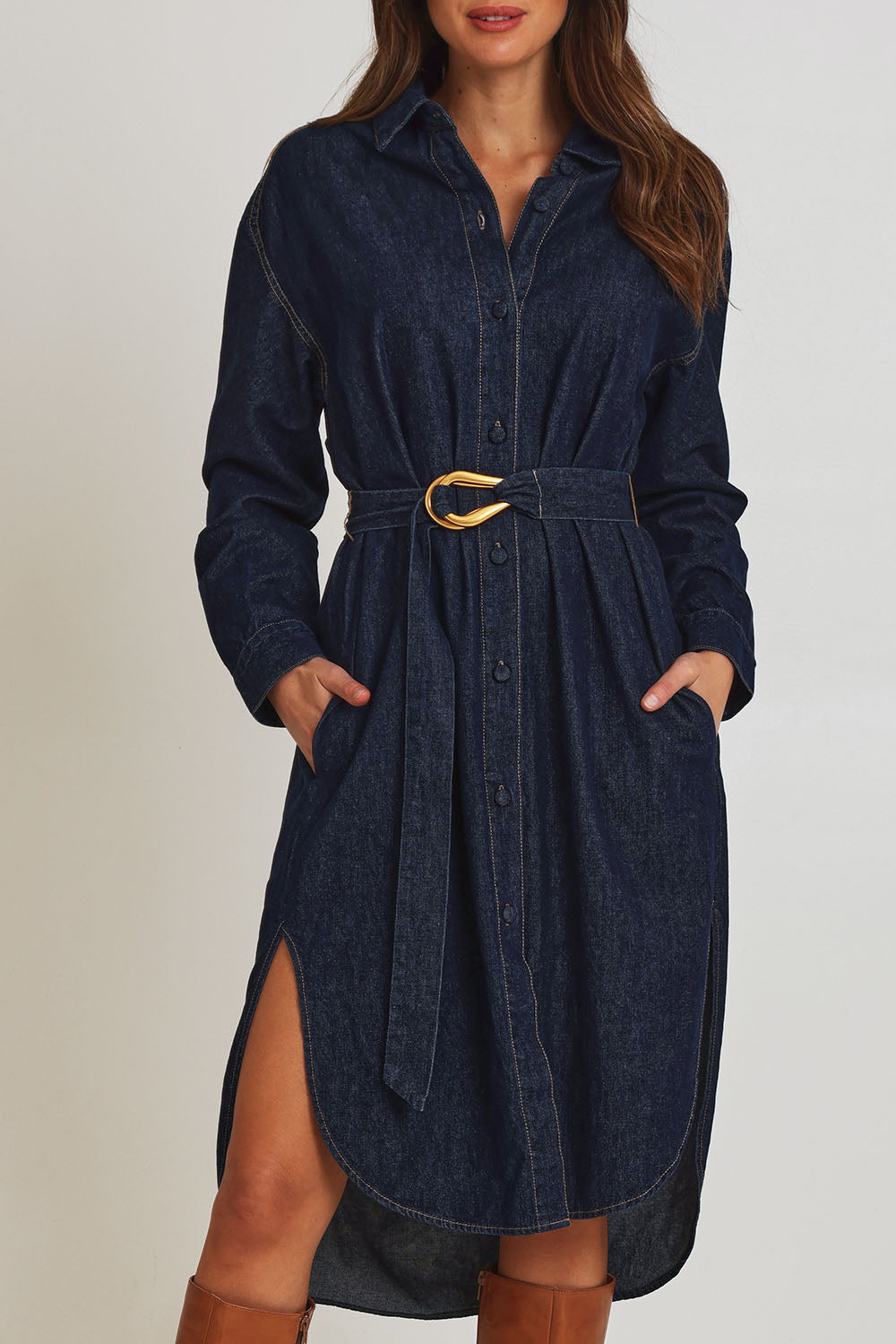 Model Madeline wearing size 10 of the Soaring Denim Shirt Dress in colour Indigo (Blue), from the front, cropped image