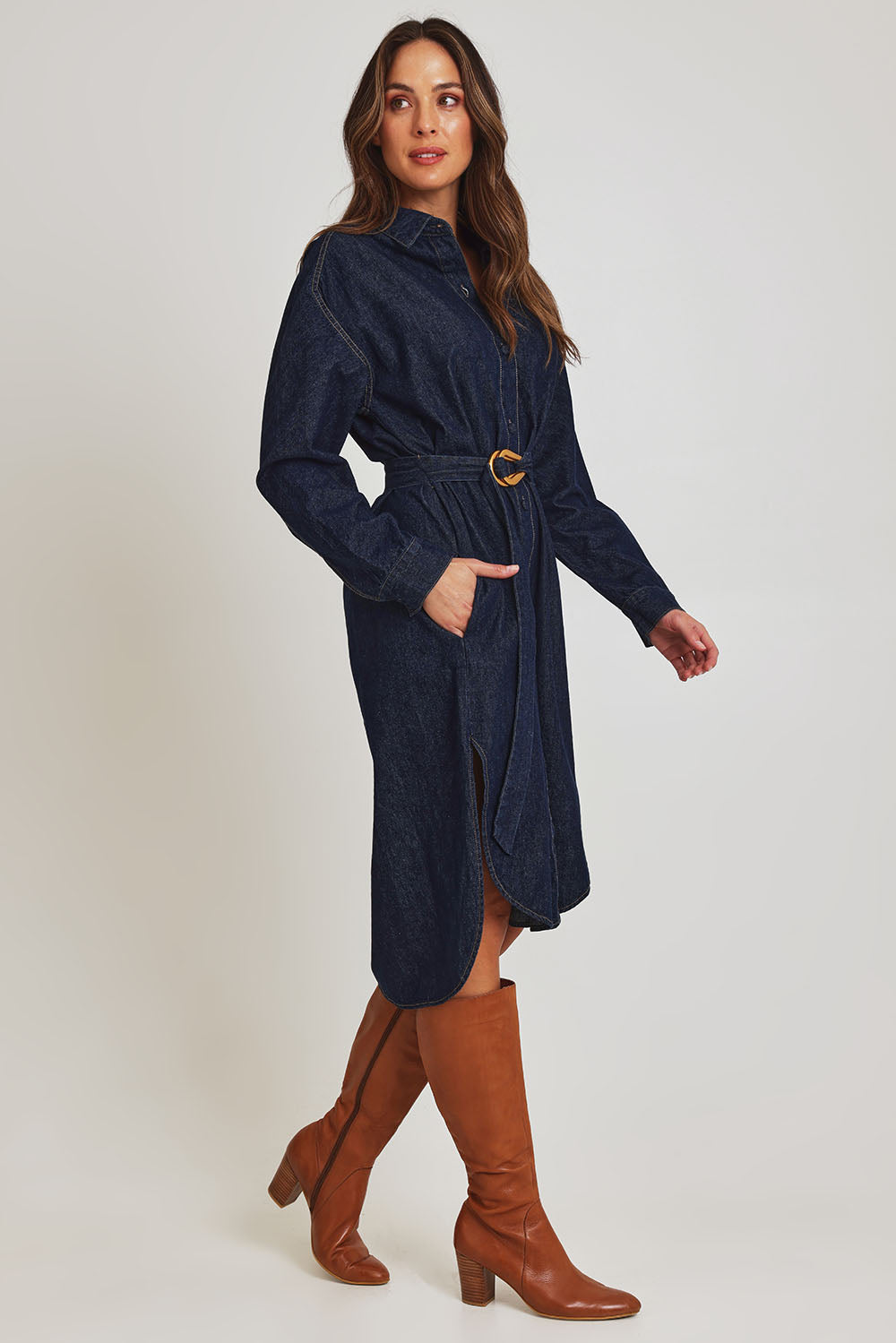 Model Madeline wearing size 10 of the Soaring Denim Shirt Dress in colour Indigo (Blue), from the front, showing the whole outfit