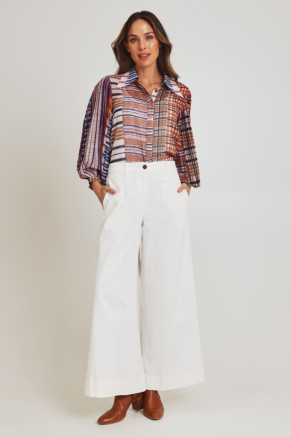 Model Madeline wearing size 10 of the Rays Shirt in colour Check (Blue), from the front, showing the whole outfit