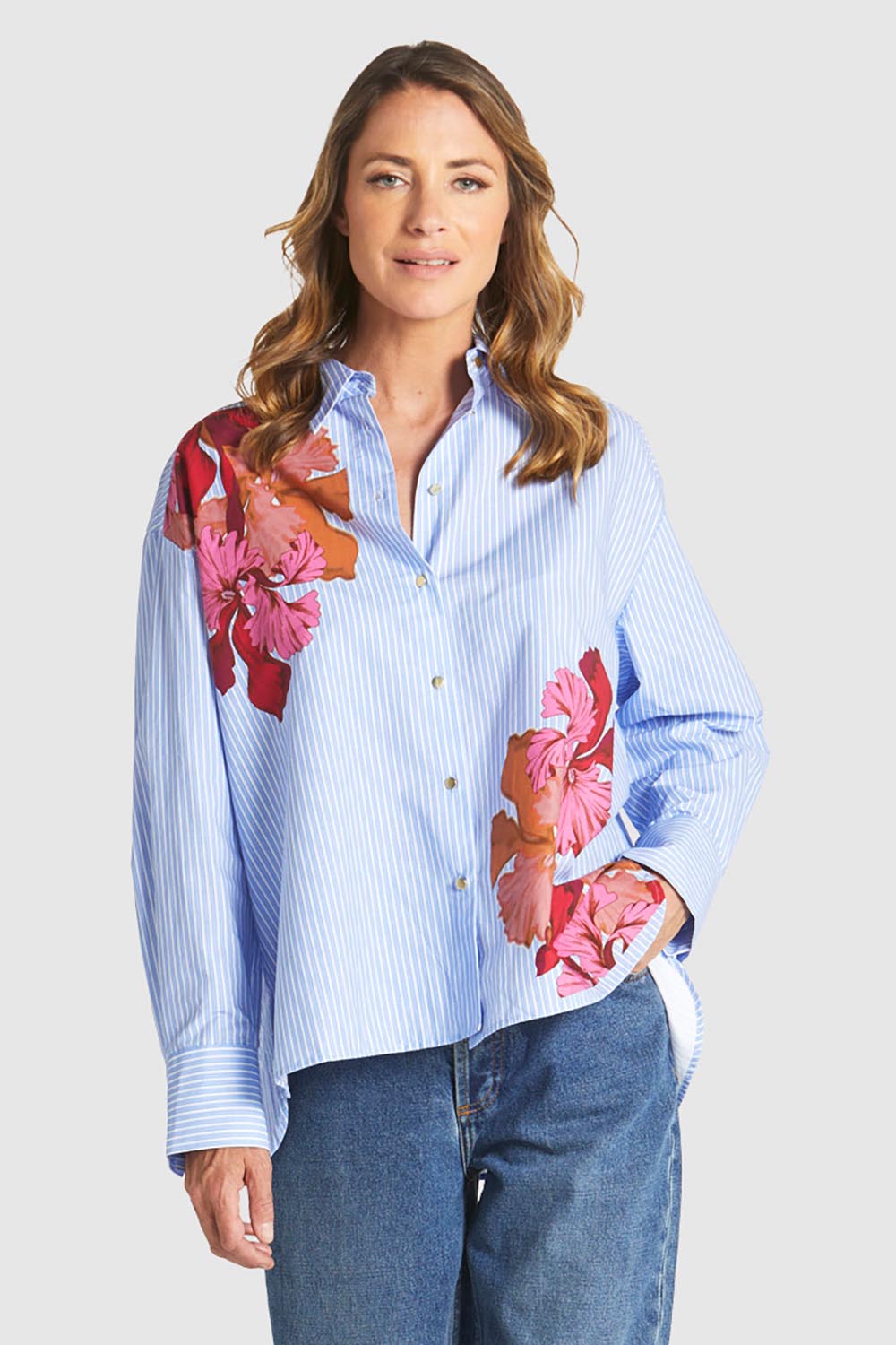 A model wearing the Sweet Jane Cotton Shirt in colour Stripe (Blue), from the front, cropped image
