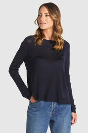 A model wearing the Reminiscent Knit Top in colour Navy (Blue), from the front, showing the whole outfit
