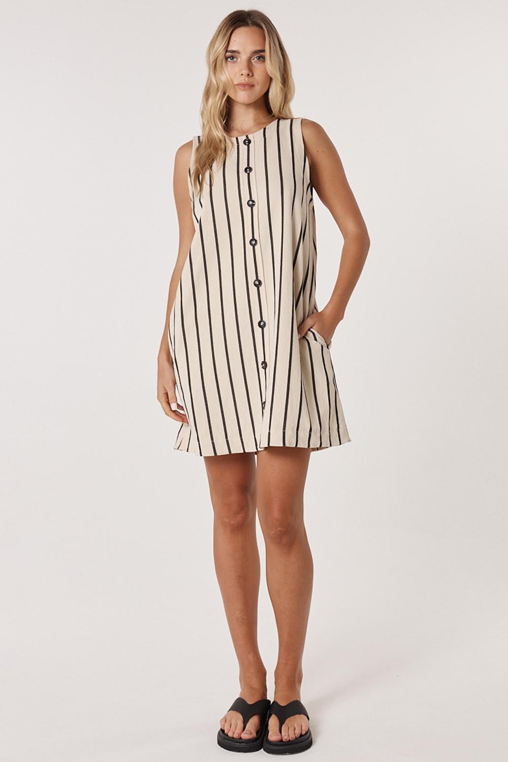 A model wearing the Luna Cotton Blend Dress in colour Creamblack, from the front, showing the whole outfit