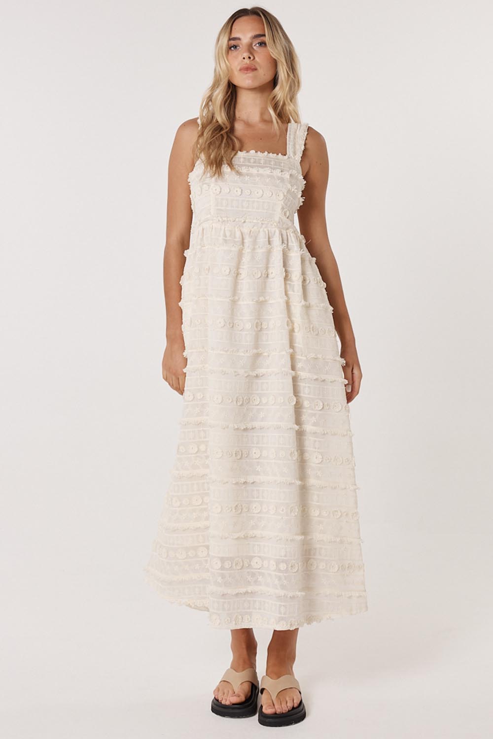 A model wearing the Sierra Lyocell Blend Lace Dress in colour Cream, from the front, showing the whole outfit