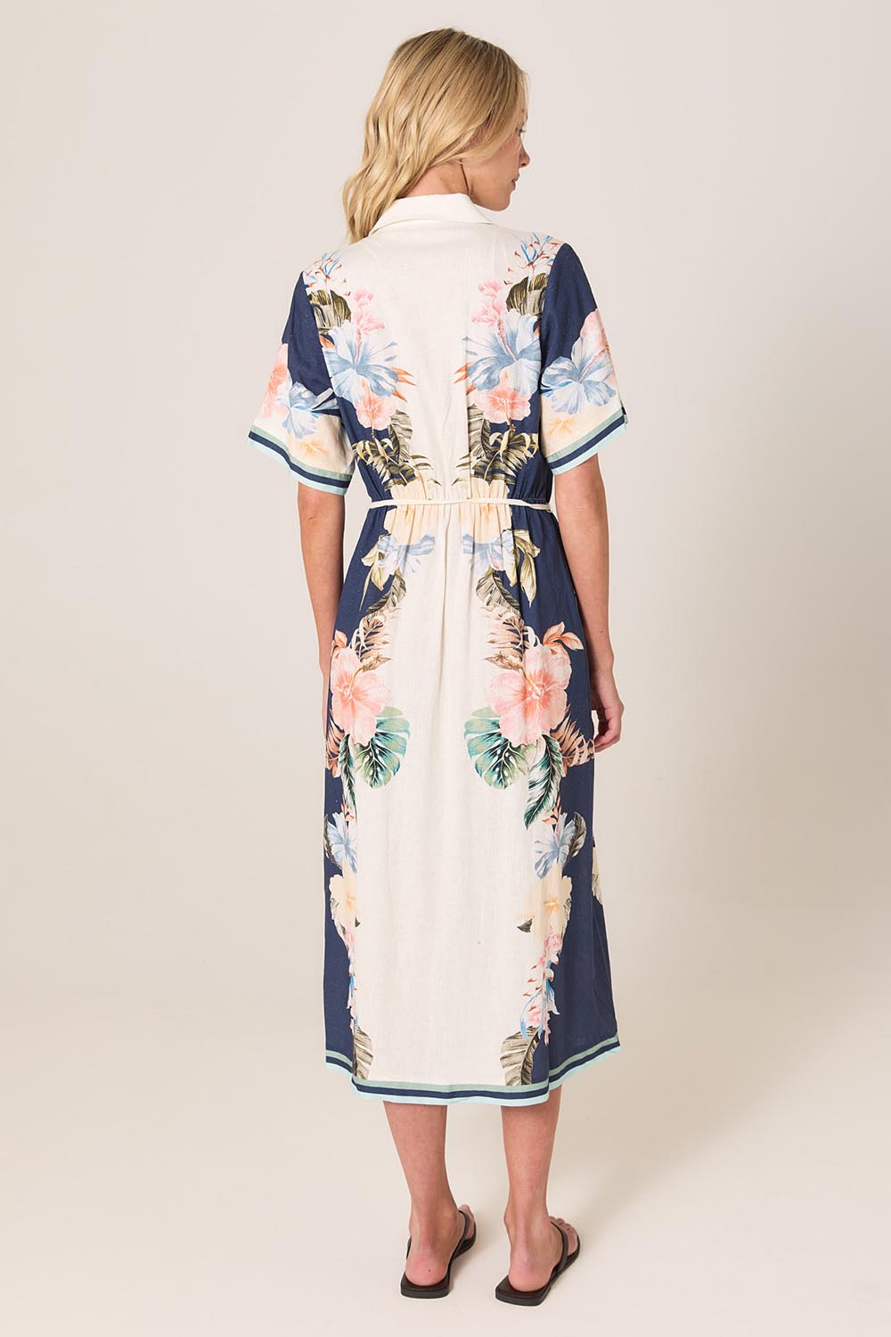 A model wearing the Solara Linen Blend Shirt Dress in colour Navy (Blue), from the back
