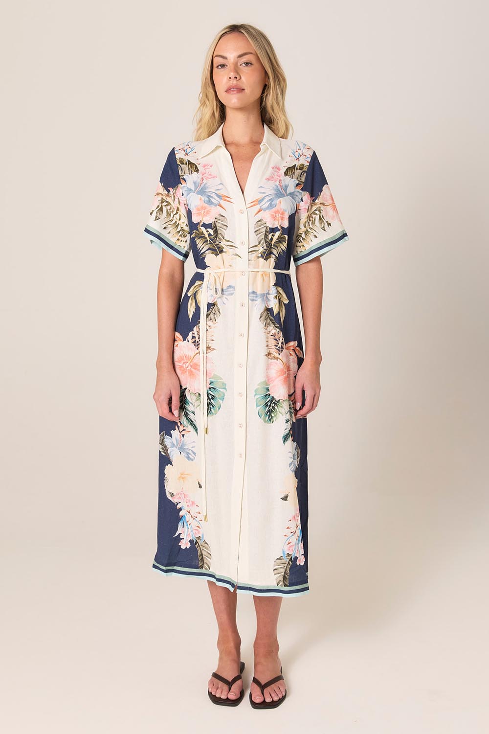 A model wearing the Solara Linen Blend Shirt Dress in colour Navy (Blue), from the front, showing the whole outfit