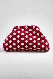 Model Genericm wearing size sample of the Bondi Spot Clutch - Redwhite in colour Redwhite, from the front