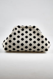Model Genericm wearing size sample of the Bondi Spot Clutch - Whiteblack in colour Whiteblack, from the front