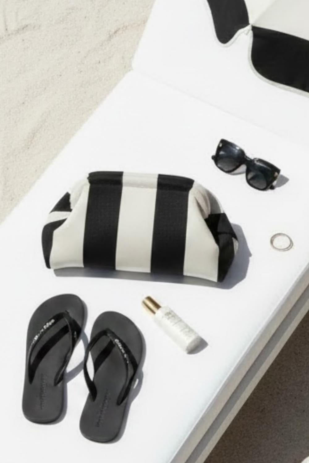 Product shot of the Laguna Stripe Clutch - Blackwhite in colour Blackwhite, from the back