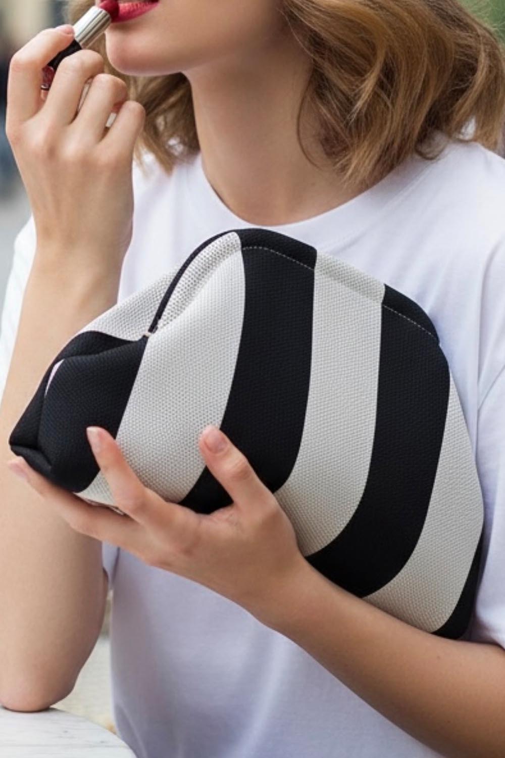 Product shot of the Laguna Stripe Clutch - Blackwhite in colour Blackwhite, from the front