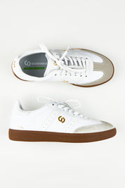 A model wearing size 37 of the 2001 Parallel Suede Canvas Sneaker in colour White (White), from the front, showing the whole outfit