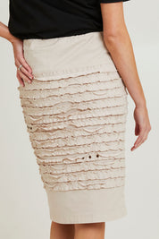 Model Grace wearing size 10 of the Cotton Twill Skirt in colour Natural, from the back