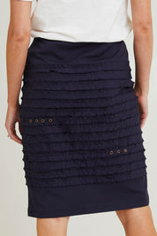 Model Grace wearing size 10 of the Cotton Twill Skirt in colour Navy (Blue), from the back
