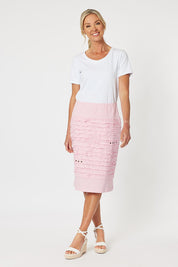 A model wearing the Cotton Twill Skirt in colour Pink (Pink), from the front, showing the whole outfit
