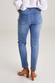 Model Emma wearing size 10 of the Marvel Jean in colour Denim (Blue), from the back