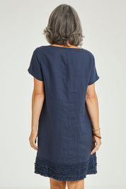 Model Luisa wearing size 10 of the Frilled Hem Linen Dress in colour Marine (Blue), from the back