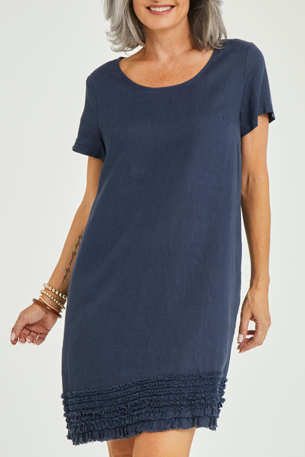 Model Luisa wearing size 10 of the Frilled Hem Linen Dress in colour Marine (Blue), from the front, cropped image