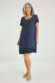 Model Luisa wearing size 10 of the Frilled Hem Linen Dress in colour Marine (Blue), from the front, showing the whole outfit