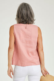 Model Luisa wearing size 10 of the Side Button Cami in colour Mango (Pink), from the back