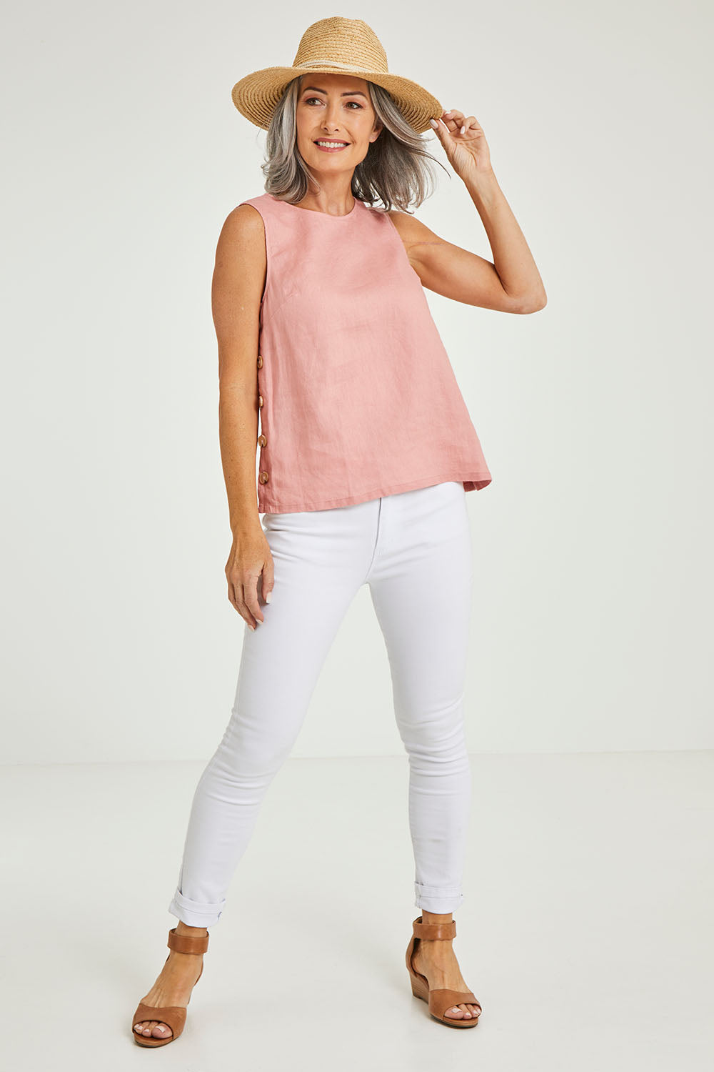 Model Luisa wearing size 10 of the Side Button Cami in colour Mango (Pink), from the front, showing the whole outfit