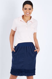 Model Pamela wearing size 10 of the Frill Hem Pull On Linen Skirt in colour Navy (Blue), from the front, cropped image