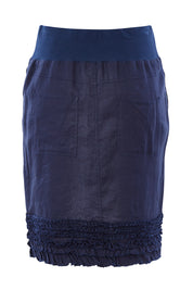 Product shot of the Frill Hem Pull On Linen Skirt in colour Navy (Blue), from the back