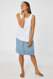 Model Cara wearing size 10 of the Frill Hem Pull On Linen Skirt in colour Powder (Blue), from the front, showing the whole outfit