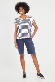 Model Aiyana wearing size 10 of the Pull On Linen Short in colour Marine (Blue), from the front, showing the whole outfit