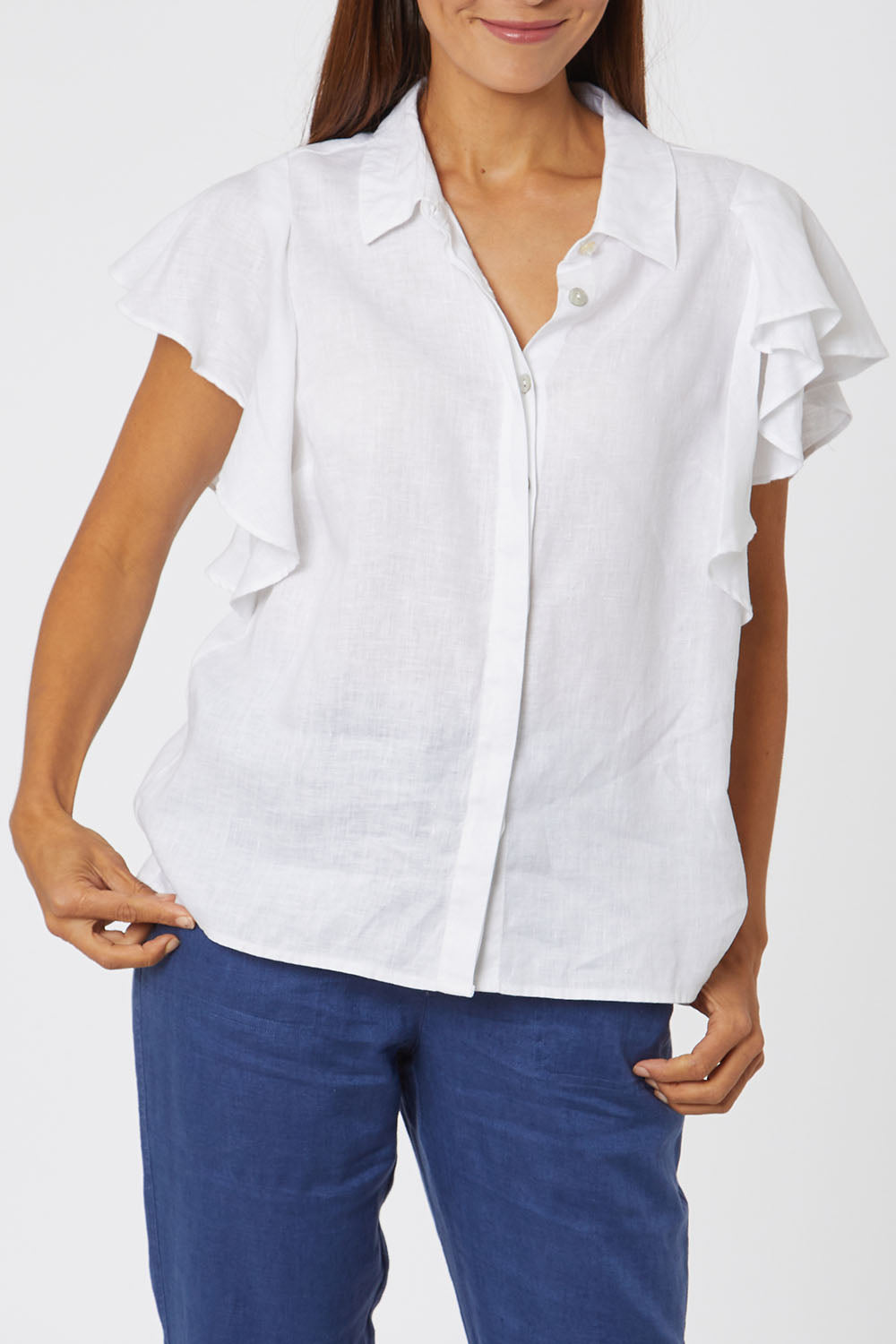 Model Cara wearing size 10 of the Ruffle Sleeve Shirt in colour White (White), from the front, cropped image