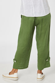 Model Cara wearing size 10 of the Side Button Pant in colour Green (Green), from the back