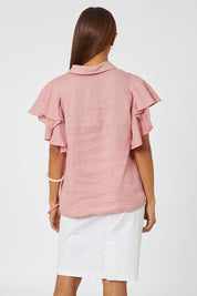 Model Cara wearing size 10 of the Miracle Denim Skirt in colour White (White), from the back