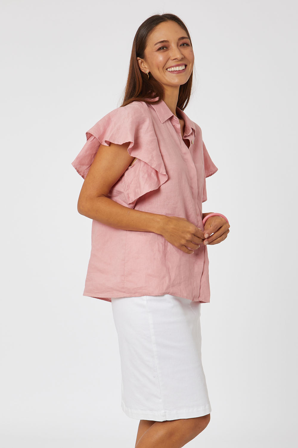 Model Cara wearing size 10 of the Miracle Denim Skirt in colour White (White), from the front, cropped image