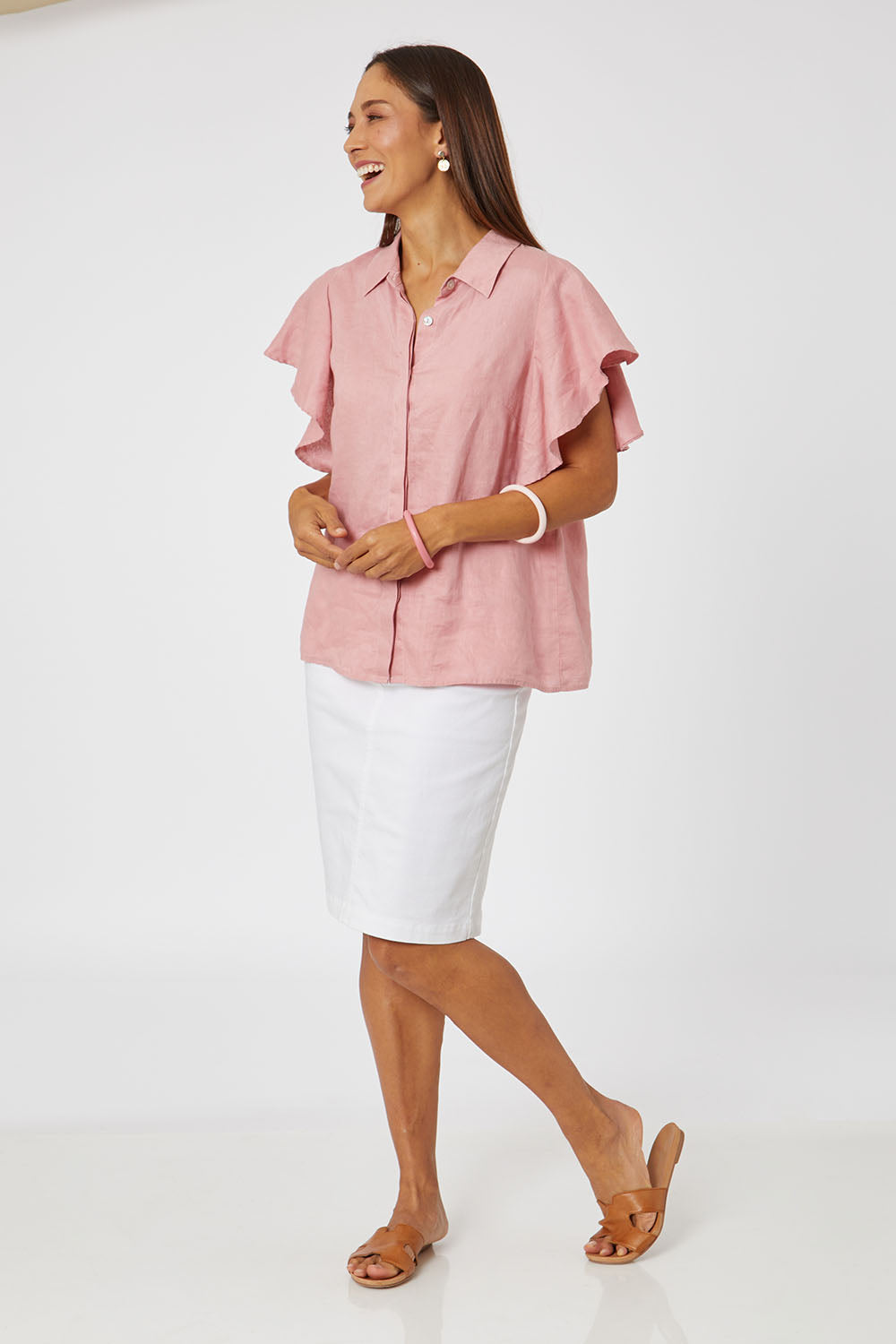 Model Cara wearing size 10 of the Miracle Denim Skirt in colour White (White), from the front, showing the whole outfit