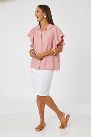 Model Cara wearing size 10 of the Miracle Denim Skirt in colour White (White), from the front, showing the whole outfit