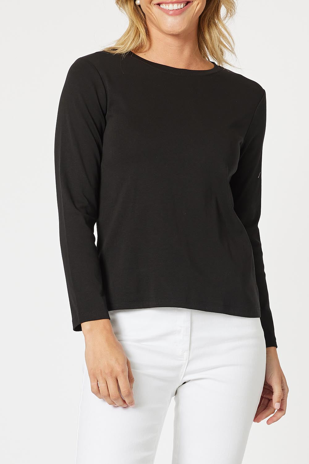 A model wearing the Crew Neck Long Sleeve Cotton Top in colour Black (Black), from the front, cropped image