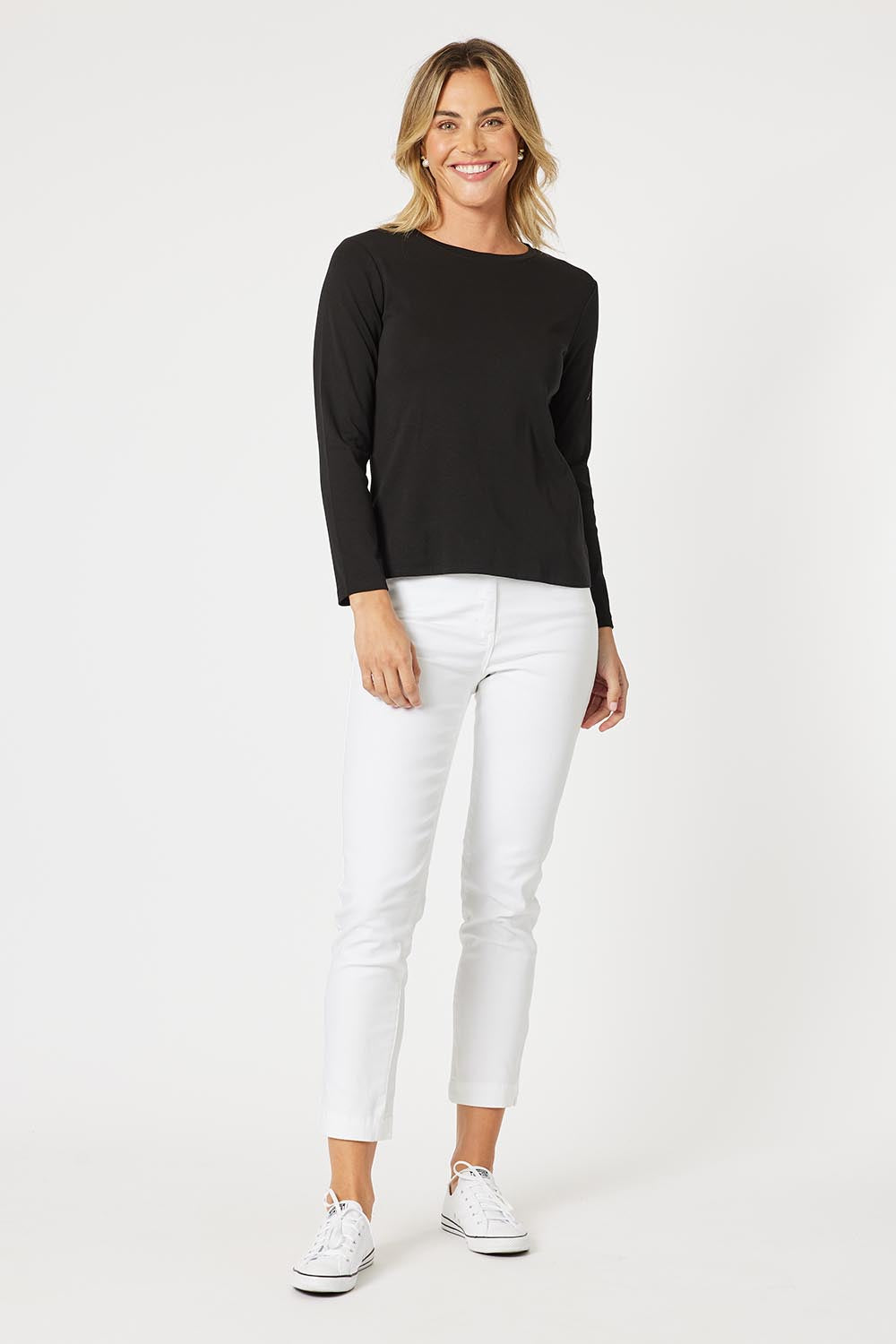 A model wearing the Crew Neck Long Sleeve Cotton Top in colour Black (Black), from the front, showing the whole outfit