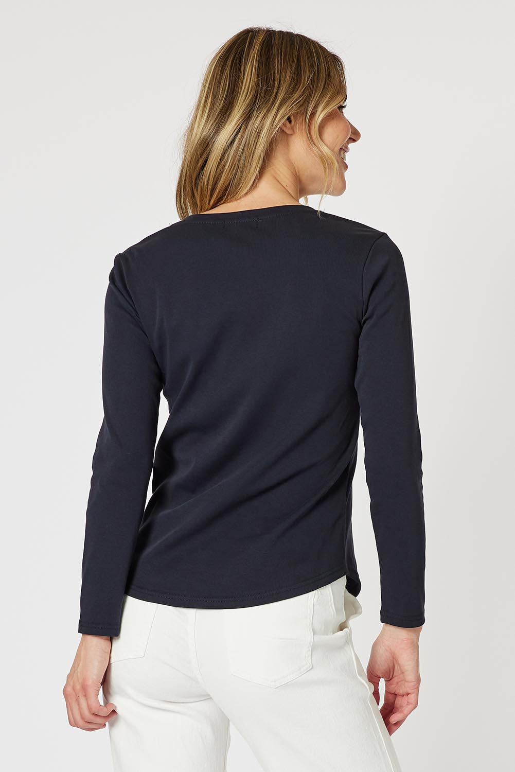 A model wearing the Crew Neck Long Sleeve Cotton Top in colour Navy (Blue), from the back