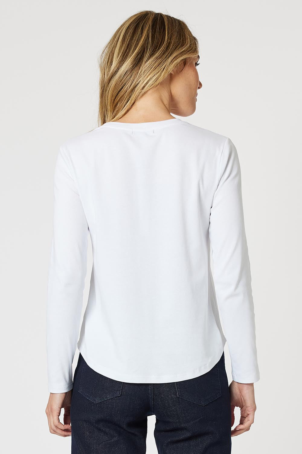 A model wearing the Crew Neck Long Sleeve Cotton Top in colour White (White), from the back