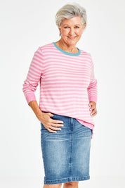 Model Elise wearing size 10 of the Miracle Denim Straight Skirt in colour Denim (Blue), from the front, cropped image